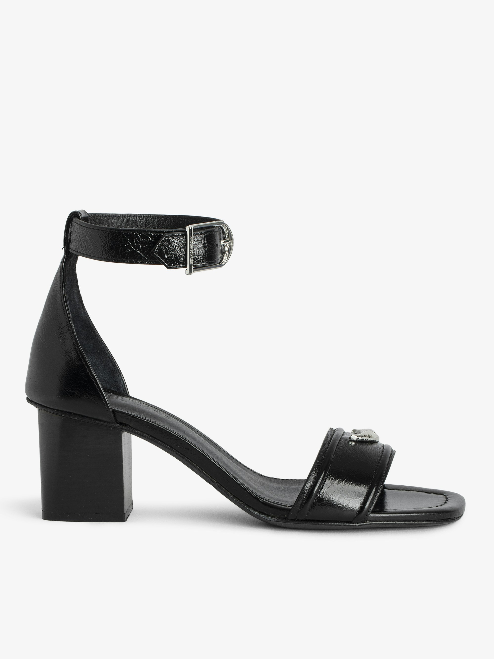 Caprese Sandals - Heeled sandals with leather strap adorned with a wing charm and a signature buckle.