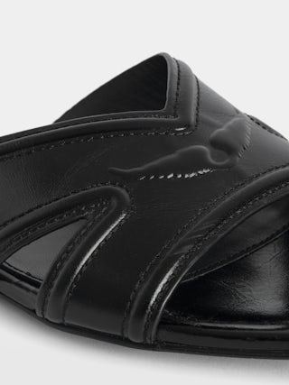 Azora Vintage Patent Mules - Mules in vintage-effect leather signed with embossed wings.