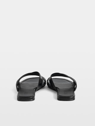 Azora Vintage Patent Mules - Mules in vintage-effect leather signed with embossed wings.