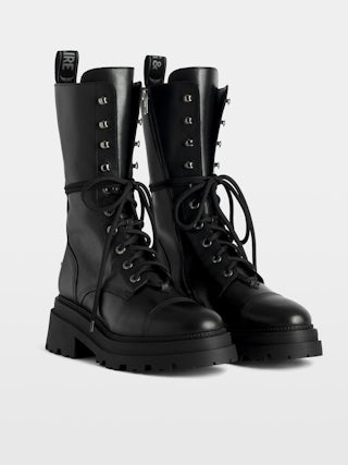 Ride High-Top Boots - High-top ankle boots in smooth semi-glossy black leather adorned with a wing charm and laces.