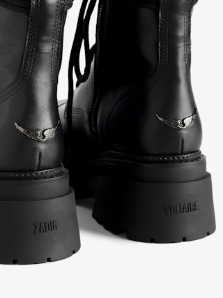 Ride High-Top Boots - High-top ankle boots in smooth semi-glossy black leather adorned with a wing charm and laces.
