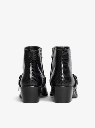 Ankle boots Tylow Wild Mirror - Ankle boots in python-effect leather adorned with signature buckles and metallic wing-shaped studs.