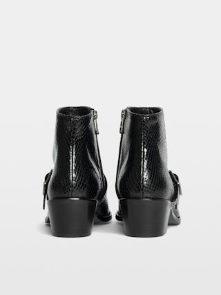 Ankle boots Tylow Wild Mirror - Ankle boots in python-effect leather adorned with signature buckles and metallic wing-shaped studs.