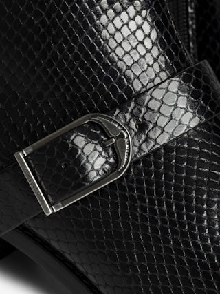 Ankle boots Tylow Wild Mirror - Ankle boots in python-effect leather adorned with signature buckles and metallic wing-shaped studs.