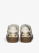 Basses Fly Wings Cracked Sneakers - Low-top sneakers in a mix of worn and cracked leather with embossed wings.