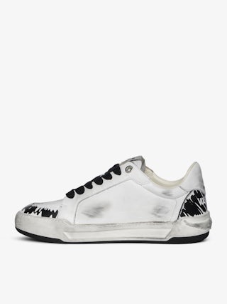Basses Fly Wings Sneakers - Low-top sneakers in worn-effect leather with embossed wings.
