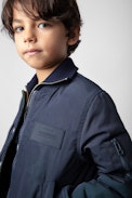 Charlie Boys’ Jacket - Boys’ plain navy blue reversible jacket with camouflage print and ZV embroidery.