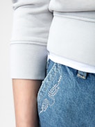 Elle Girls’ Shorts - Girls’ blue denim shorts with diamanté wings.