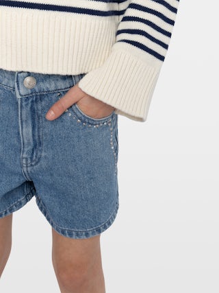Shorts Elle Denim Girl - Denim shorts with front patch pockets, rhinestones and studs along the seams. Adjustable waist up to age 10.