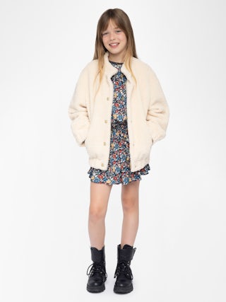 Maddy Girl's Jacket - Round neck jacket with elastic cuffs and hem, piped pocket, felt logo and embroidery on the back.