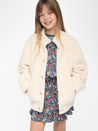 Maddy Girl's Jacket - Round neck jacket with elastic cuffs and hem, piped pocket, felt logo and embroidery on the back.