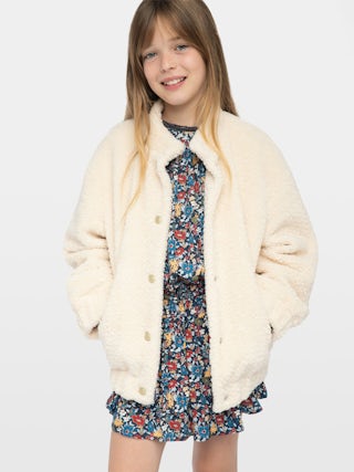 Maddy Girl's Jacket - Round neck jacket with elastic cuffs and hem, piped pocket, felt logo and embroidery on the back.