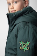 Parka April für Mädchen - Wasserabweisender Daunenparka mit Kapuze zum Wenden in Dunkelgrün für Mädchen.