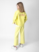 Jacke Timmy für Mädchen - Gelbe Mädchenjacke aus Baumwolltwill mit „Amour“-Schriftzug auf dem Rücken.
