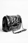 Sac Ziggy Patent - Sac noir femme en cuir matelassé verni.