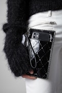 Pochette Phone Wallet Embossed - Pochette Phone Wallet in pelle nera all-over