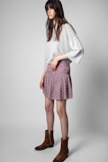 Javala short skirt - Patterned short skirt on pink background