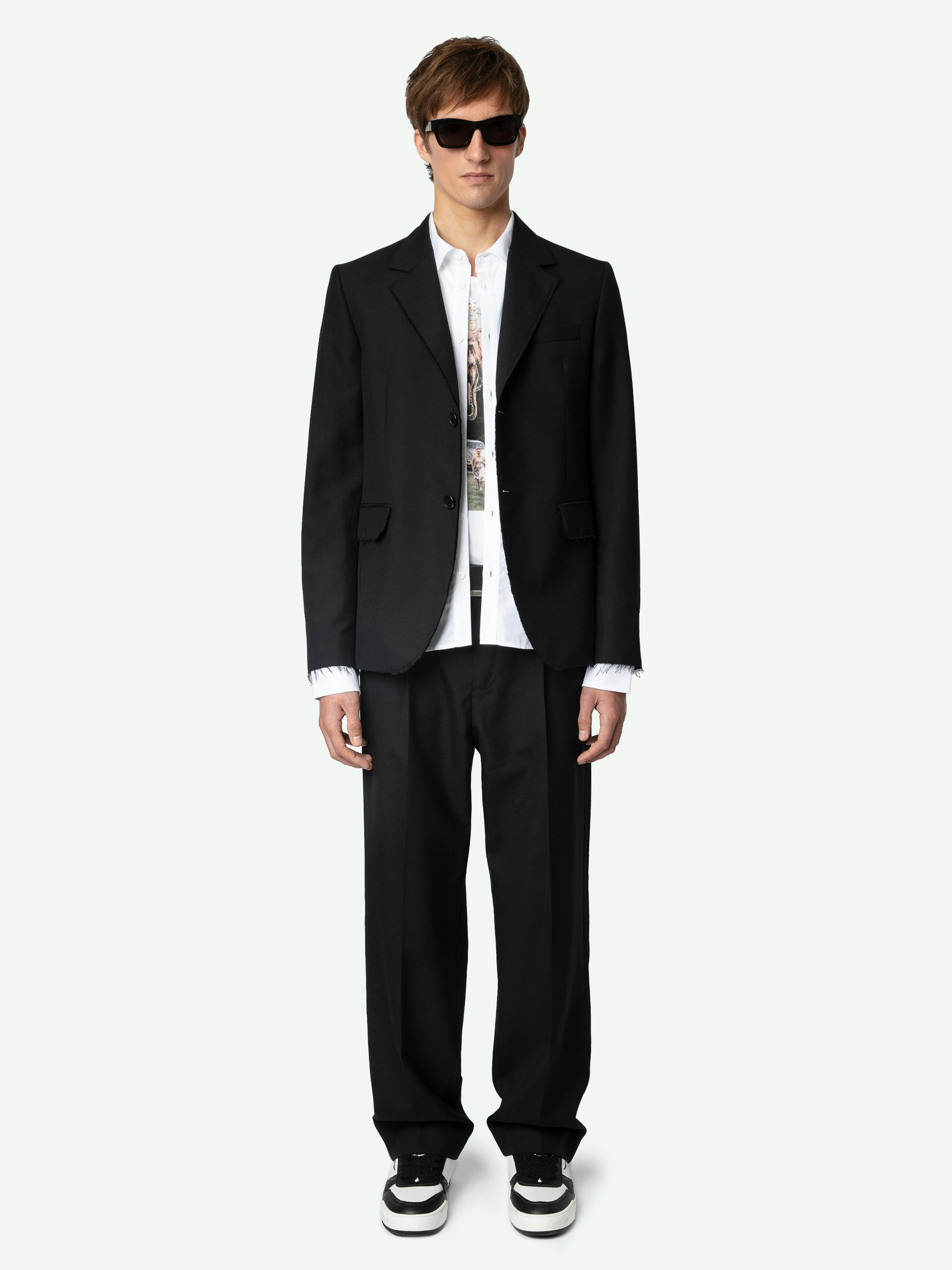 Vanilleh Blazer - Black wool straight-cut blazer with button fastening, pockets, raw hems and Studio label.