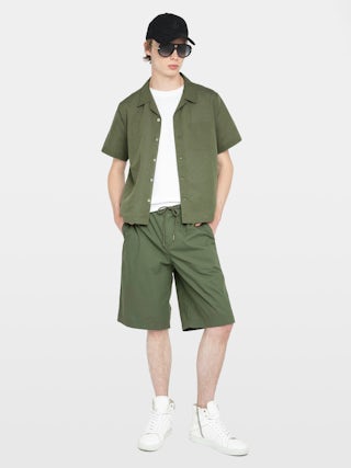 Pally Bermuda Shorts - Knee-length wide Bermuda shorts with elasticated waistband and drawstring, central button fastening and zip closure, accompanied by a western-inspired embroidery.