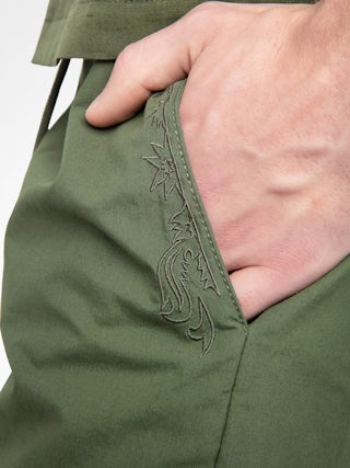 Pally Bermuda Shorts - Knee-length wide bermuda shorts with elasticated waistband and drawstring, central button fastening and zip closure, accompanied by a western-inspired embroidery.