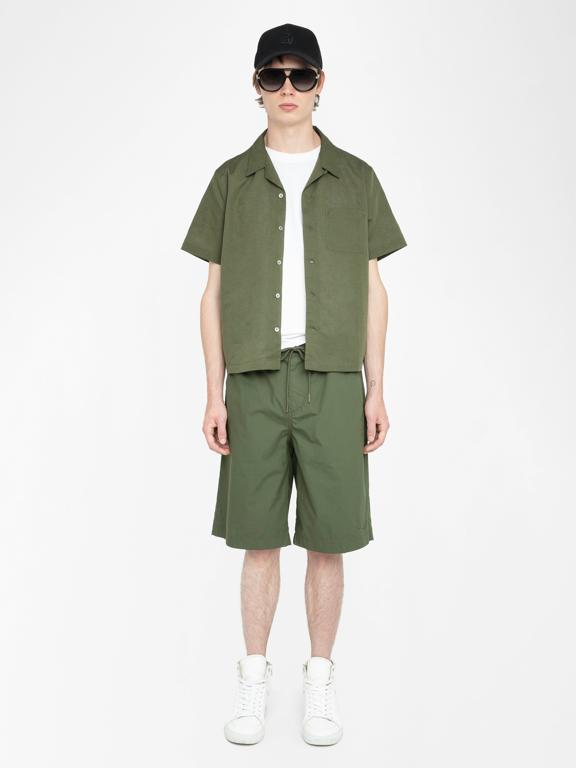 Pally Bermuda Shorts - Knee-length wide bermuda shorts with elasticated waistband and drawstring, central button fastening and zip closure, accompanied by a western-inspired embroidery.