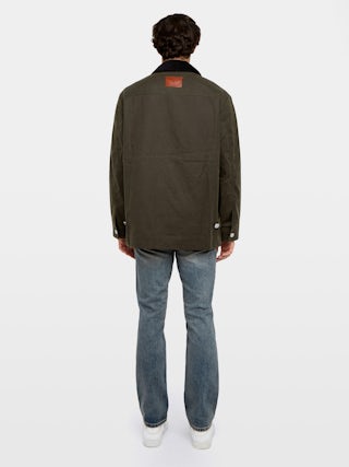 Parka Boye - Blouson en coton ciré, col contrasté en velours, fermeture boutonnée avec poches plaquées et patch jacron aile au dos.