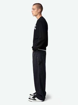 Perry Trousers - Worker-style trousers with front patch and rivet details.