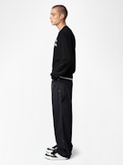 Perry Pants - Black worker-style pants with front patch and rivet details.