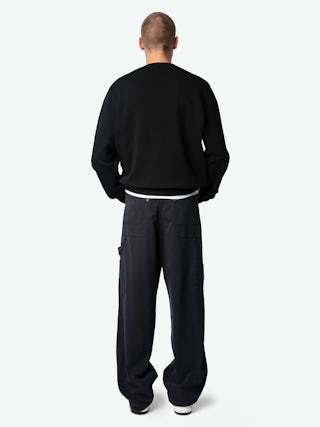 Perry Trousers - Worker-style trousers with front patch and rivet details.