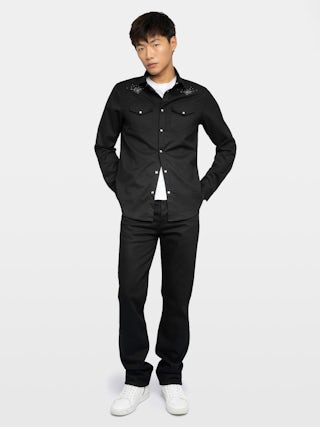 Saby Shirt - Denim shirt with flannel finish, flap pockets with wing embroidery, western-inspired details, studs, long sleeves and button fastening.