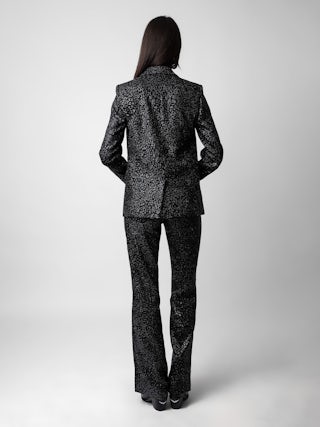 Blazer Venus Velours - Veste de tailleur blazer en velours pailleté noir motifs léopard à fermeture boutonnée.