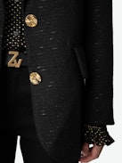 Blazer Vicka - Americana negra de tweed con bolsillos, cierre y manga abotonada.