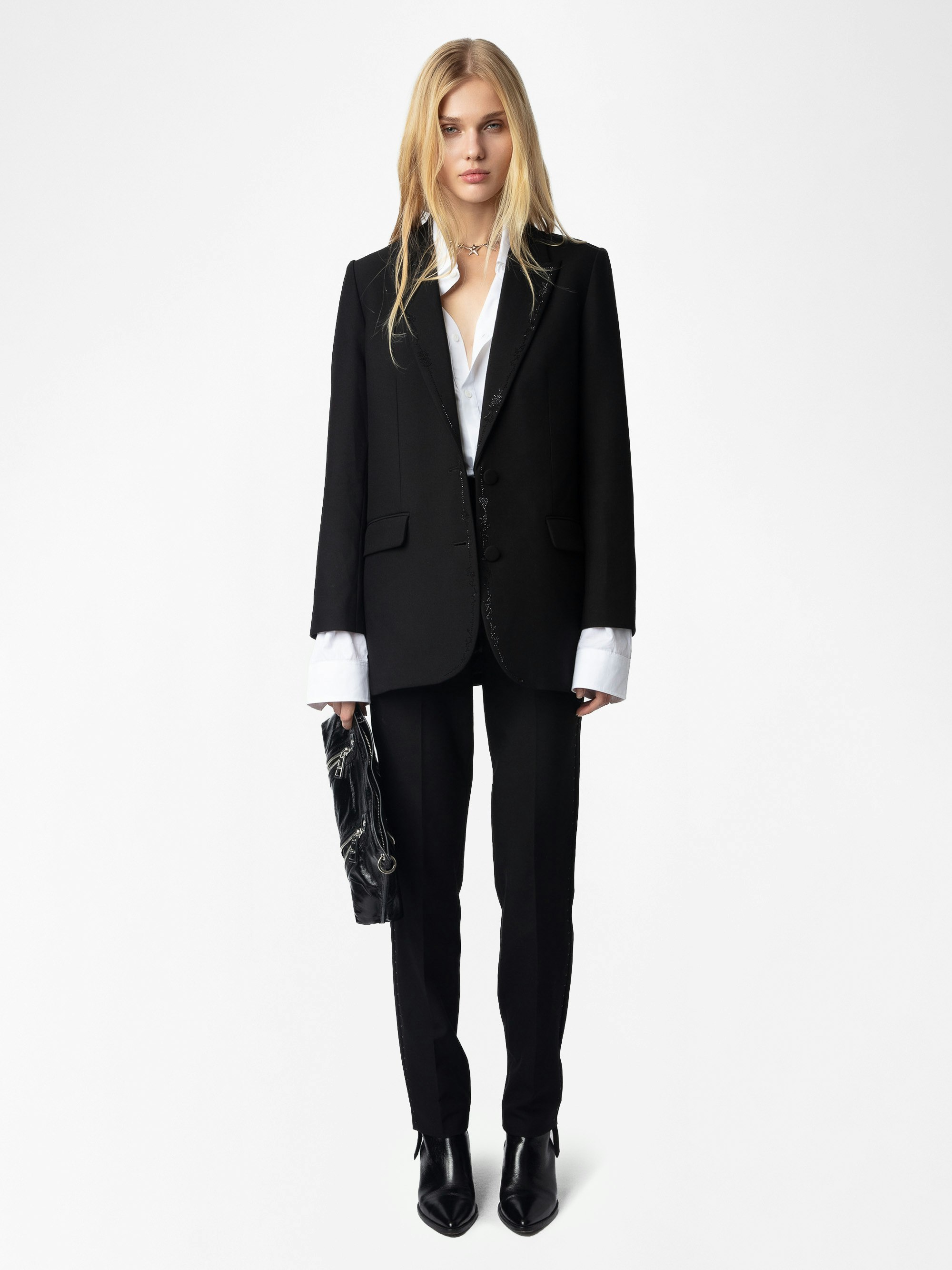 Viva Women's Rhinestone Blazer - Dazzling sophistication meets rock-inspired rebellion in this women’s rhinestone blazer. Tailored with a structured straight cut, it features shimmering rhinestone detailing along the lapels, edges, and cuffs for a bold yet refined finish. Designed to command attention, this women’s rhinestone blazer balances Parisian tailoring with a rebellious spirit, making it the ultimate statement piece for evenings, events, and beyond.