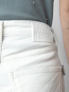 Sissi Denim Shorts - White denim shorts with pockets, overstitched details and raw hems.