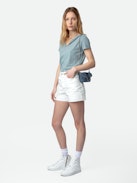 Sissi Denim Shorts - White denim shorts with pockets, overstitched details and raw hems.