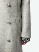 Mulan Coat - Long grey herringbone wool coat with button fastening, belt, and pockets.