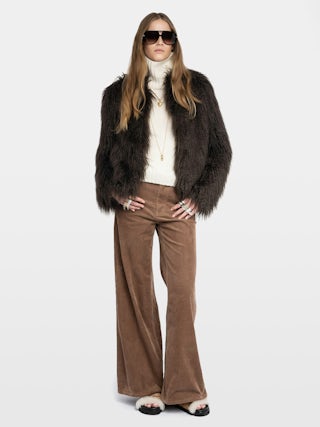 Manteau Freddie - Manteau en fausse fourrure bouclée et manches longues.