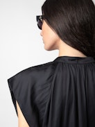 Rito Satin Dress - Add timeless elegance to your wardrobe with this women’s black satin tiered dress, designed with a flattering ruffled skirt and soft satin fabric. Featuring short cap sleeves and a tie at the neck, this dress combines romantic charm with modern sophistication. Perfect for evening events or special occasions, it’s a versatile piece that exudes effortless style.