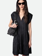 Rito Satin Dress - Add timeless elegance to your wardrobe with this women’s black satin tiered dress, designed with a flattering ruffled skirt and soft satin fabric. Featuring short cap sleeves and a tie at the neck, this dress combines romantic charm with modern sophistication. Perfect for evening events or special occasions, it’s a versatile piece that exudes effortless style.