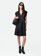 Rito Satin Dress - Add timeless elegance to your wardrobe with this women’s black satin tiered dress, designed with a flattering ruffled skirt and soft satin fabric. Featuring short cap sleeves and a tie at the neck, this dress combines romantic charm with modern sophistication. Perfect for evening events or special occasions, it’s a versatile piece that exudes effortless style.