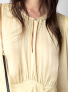 Rhodri Satin Dress - Light yellow satin mini dress with button closure and 3/4-length sleeves.