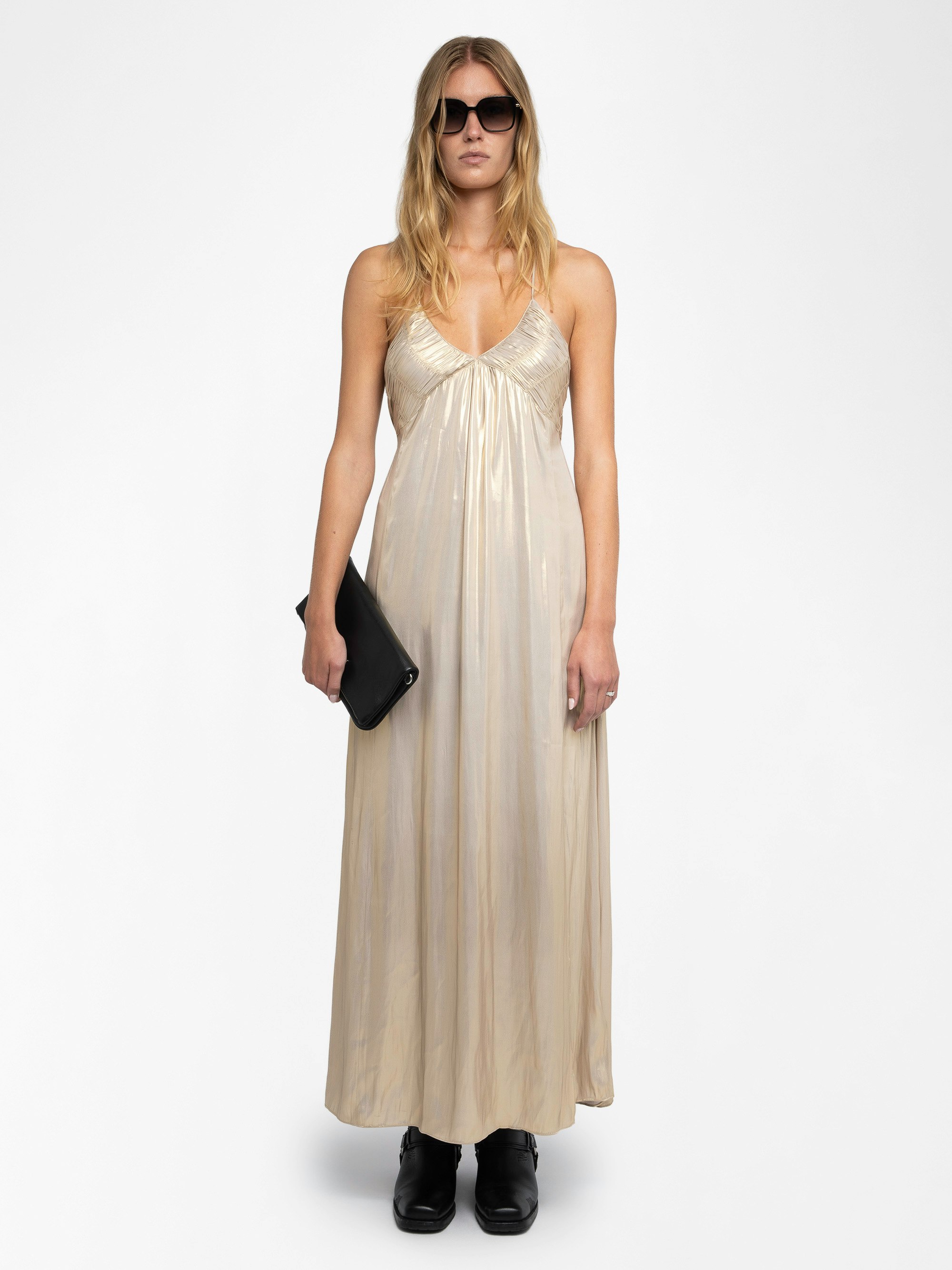 Rayonne Satin Dress - This long, pleated dress is crafted from luxurious satin, featuring a lingerie-inspired design with a sultry slit and adjustable cross-over straps for a personalized fit. Available in a radiant gold hue, this dress exudes sophistication and effortless style. The Rayonne Satin Dress is a timeless addition to any wardrobe, perfect for both day and evening occasions.