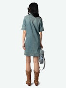Record Denim Dress - Short military-inspired denim dress with short sleeves, laced neckline, and multiple pockets.