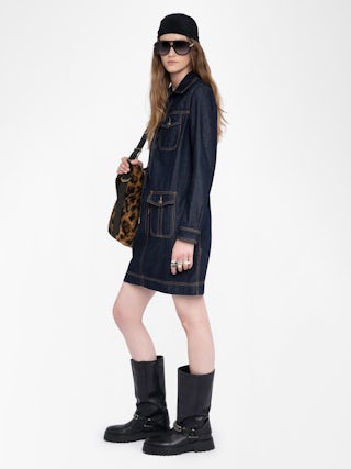 Remacha Denim Dress - Short dress in raw denim, long sleeves, applied military-style pockets and deep laced neckline.
