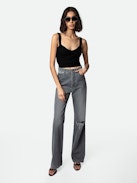 Evy Jeans - Women’s flared denim jeans with slit and embroidered “Art Is Truth” message