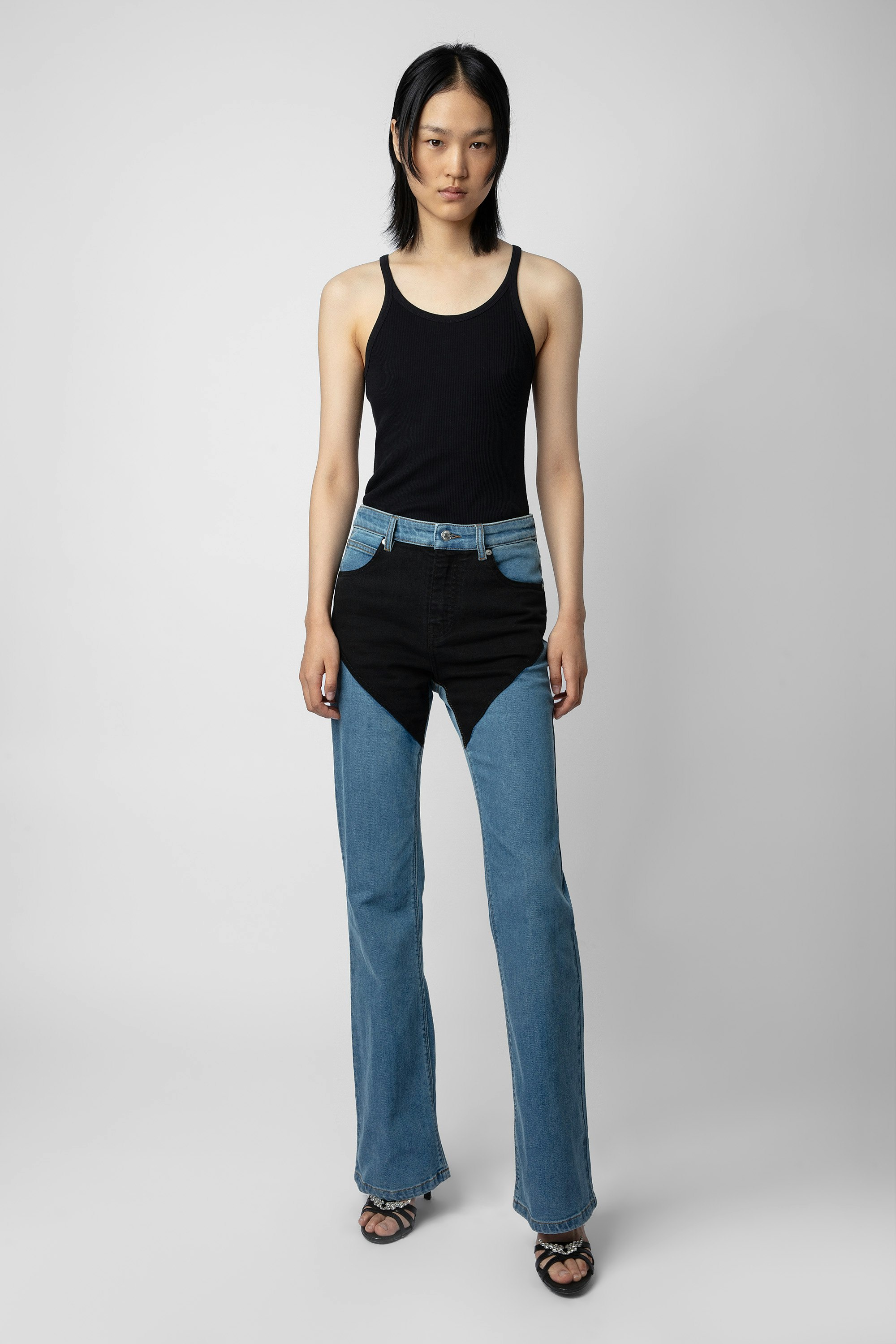 Emila Jeans - Women’s wide-leg blue denim jeans with contrasting black panels.