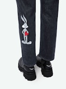 Patti Jeans - Faded black denim cropped jeans with Looney Tunes stud embellishment.