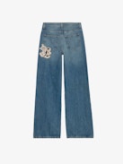 Whitney Wide Leg Patch Jeans - Women's wide leg medium wash jeans with Sylvester & Buggs Bunny patches.