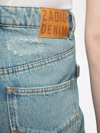 Elio Distressed Straight Leg Jeans - Effortless, timeless, undeniably cool. The Elio distressed straight leg jeans channel vintage inspiration with authentic French denim craftsmanship. These distressed straight leg jeans feature a perfectly lived-in wash and subtle embroidered heart that adds romantic rebellion to your look. Designed to move with you, they're the perfect blend of comfort and rock 'n' roll attitude. Wear them your way—raw, rolled, or undone.