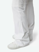 Ecume Jeans - Mid-rise bootcut jeans with braided pocket and raglan details.